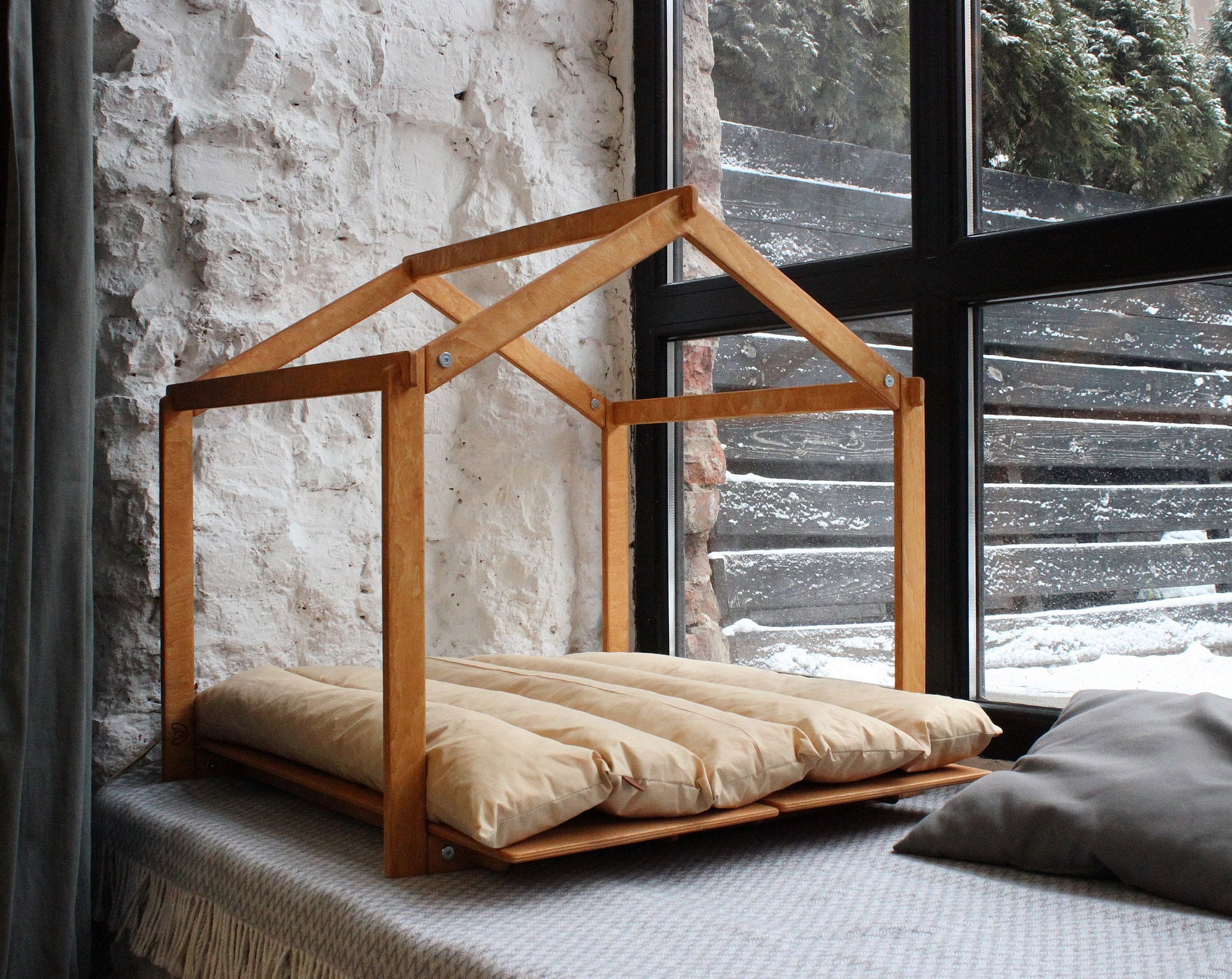 Modern indoor dog house. Wooden construction in a stylish Skelton design